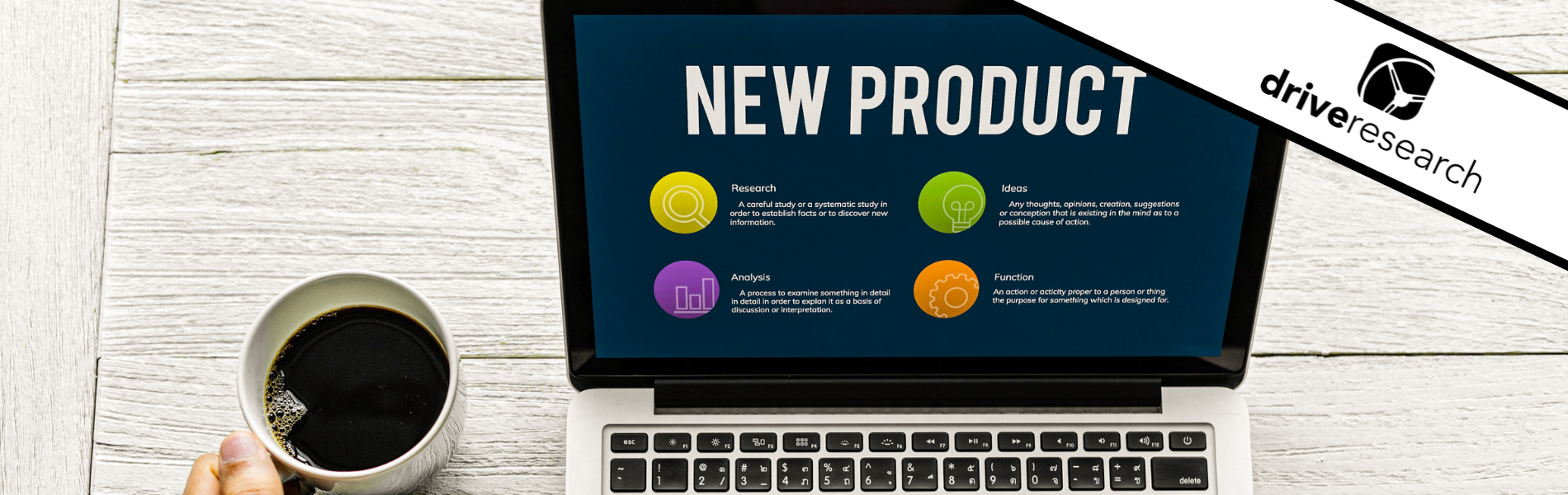 lap top that says "new product" next to a cup of coffee - drive research blog