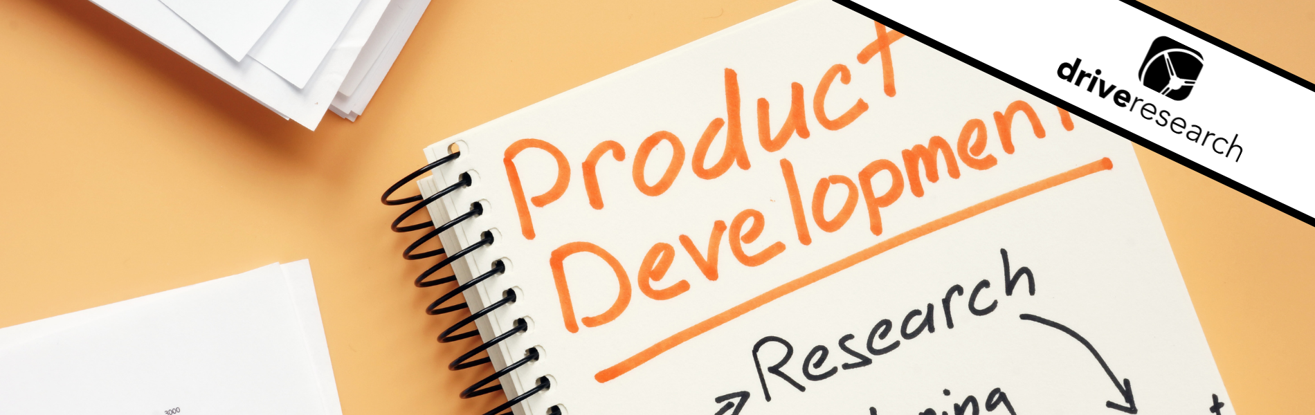 product development research written on a notebook