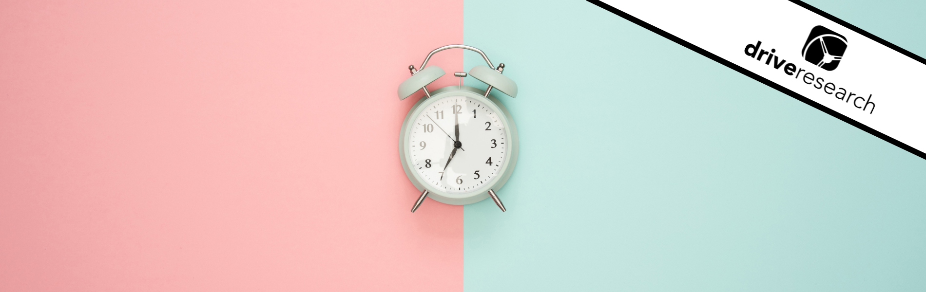 clock against a pink and blue background