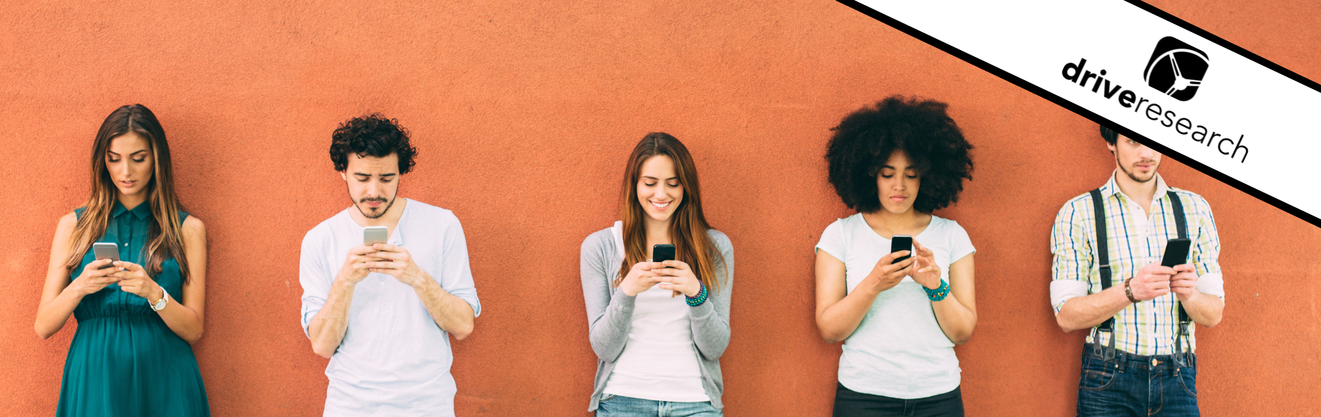 group of people texting against orange wall