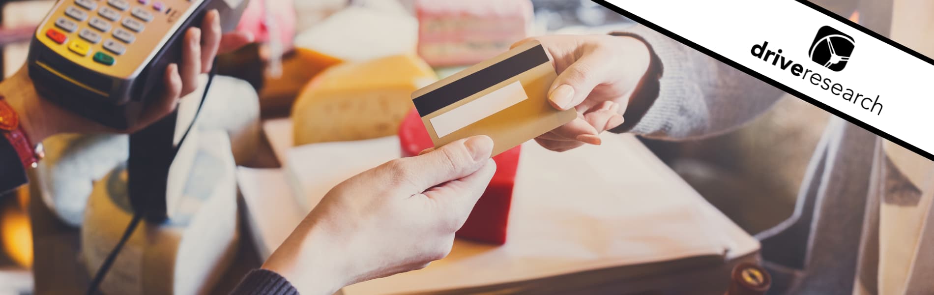 a customer handing a retail employee their credit card
