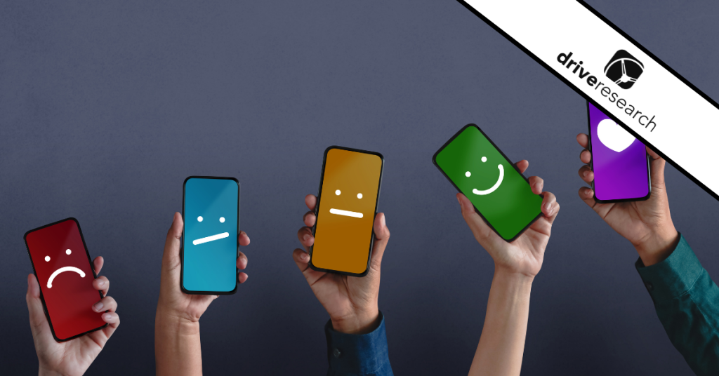 Hands Holding Smartphones with Customer Feedback Smiley Faces - Drive Research