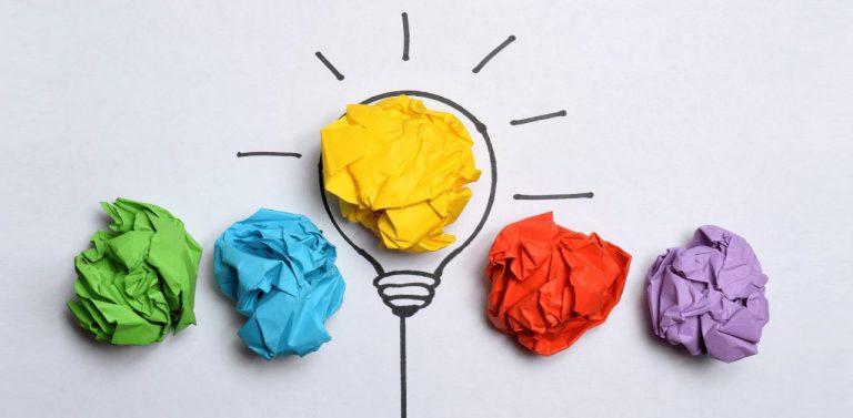 Creative flat lay composition with colorful paper balls on white background. Idea concept (1)