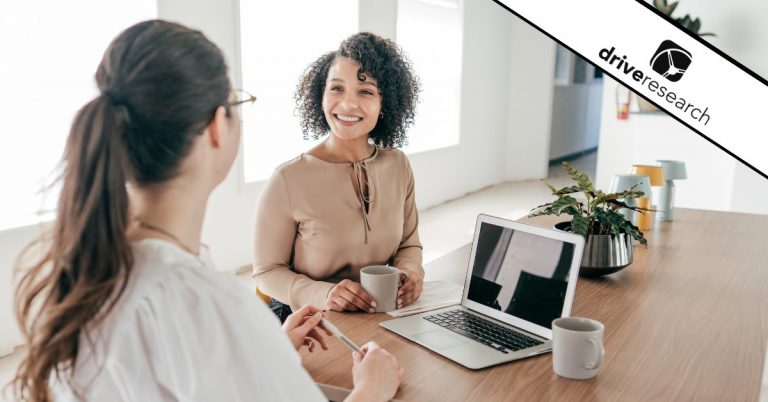 two women talking while recording showing the process of recruiting for in-depth interviews