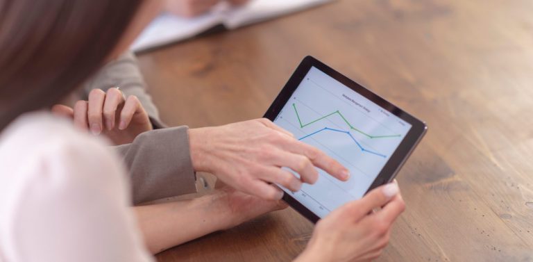 Woman tracking revenue on ipad (1)