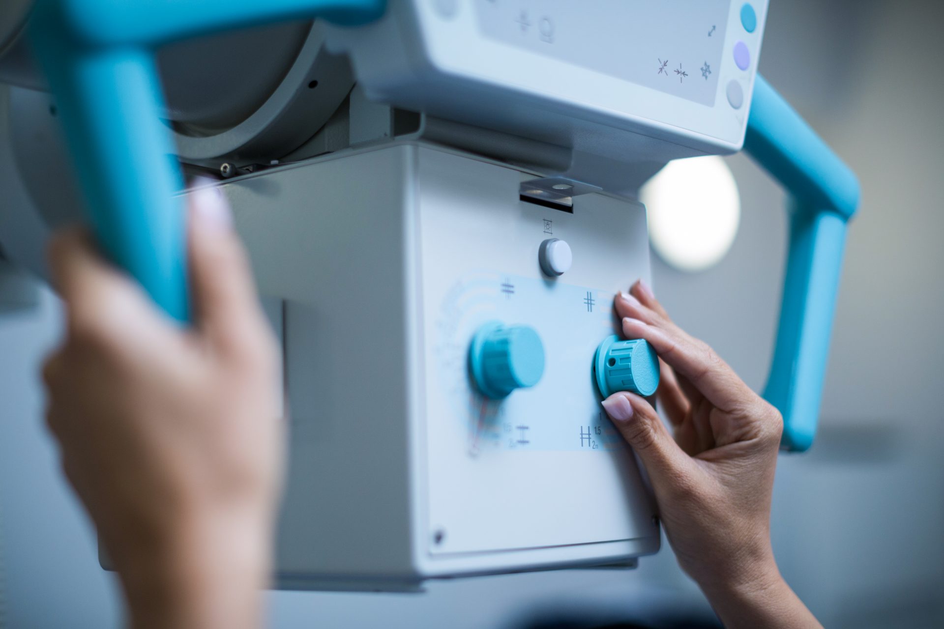 doctor using medical device to take x ray