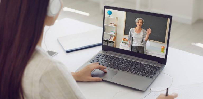 Female Student in Headphones Having Online Class
