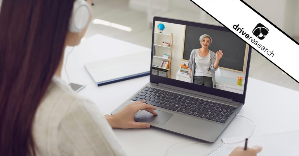 Female Student in Headphones Having Online Class - drive research