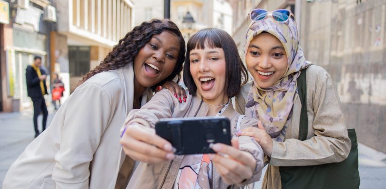 Generation Z Females Taking Selfie on Street