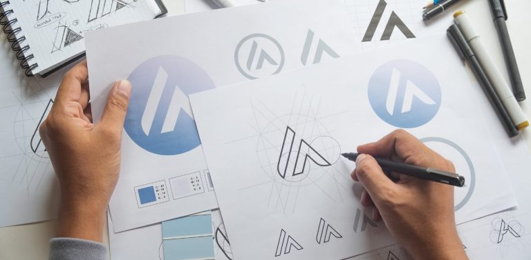 Graphic designer sketch drawing logo - featured