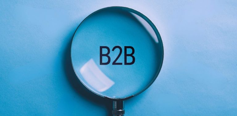 Magnified glass over B2B on blue background