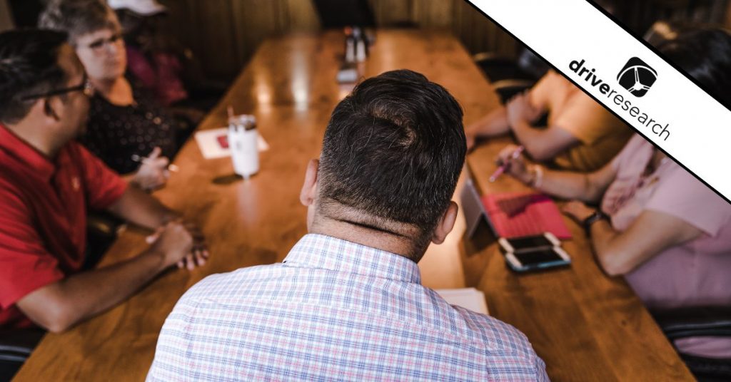 Shallow Focus Photography Of Man Facing Backward in Focus Group - Drive Research