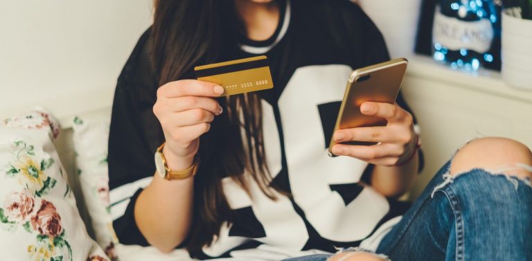 Gen Z girl shopping online with credit card - featured image