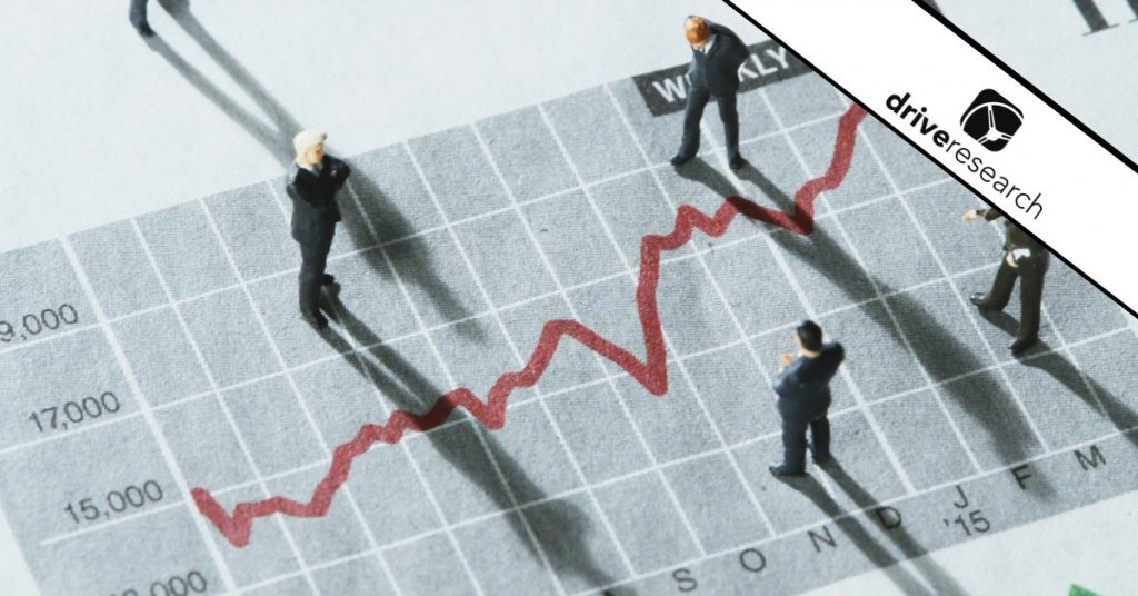 Miniature Business Professionals Analyzing Market Trends