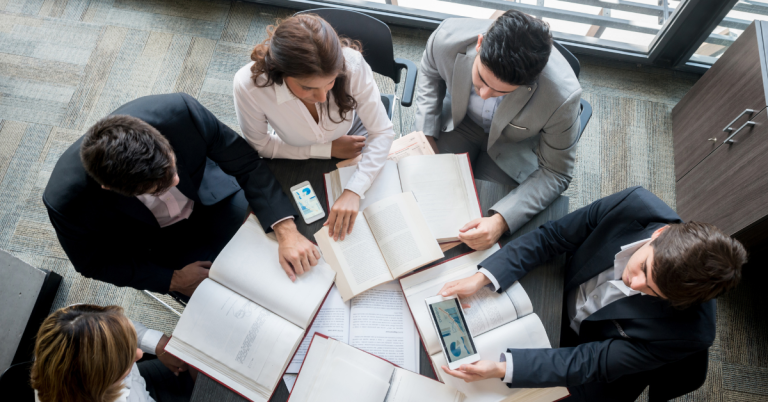 Team of business people reviewing B2B research data