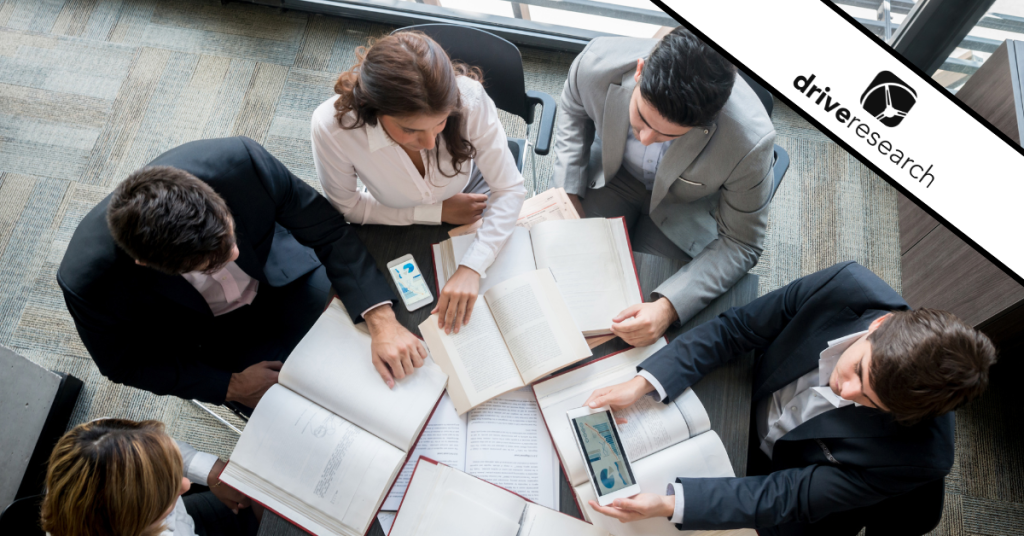 Team of researchers reviewing B2B research data
