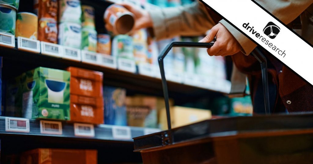 Consumer picking up item at grocery store to put in basket