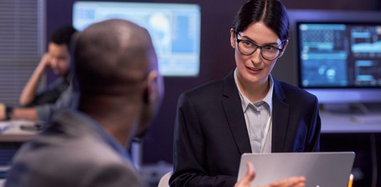 IT decision-makers talking at desks