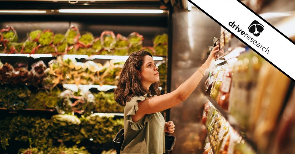 Woman Picking Out Items Off the Shelf At the Store