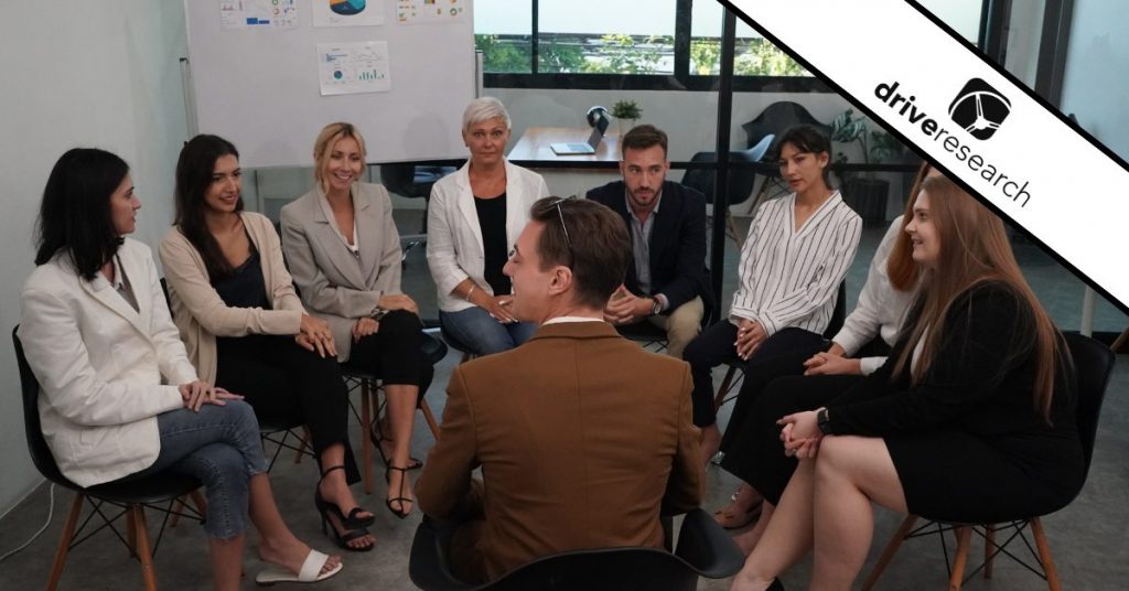 a group having a beauty focus group about a topic in an office with a moderator