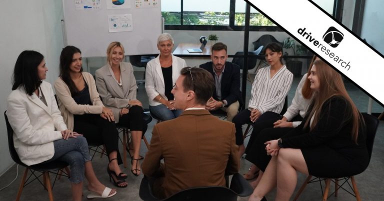 a group having a beauty focus group about a topic in an office with a moderator