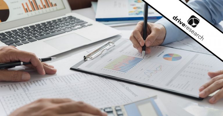 people filling out a financial wellness survey together in an office