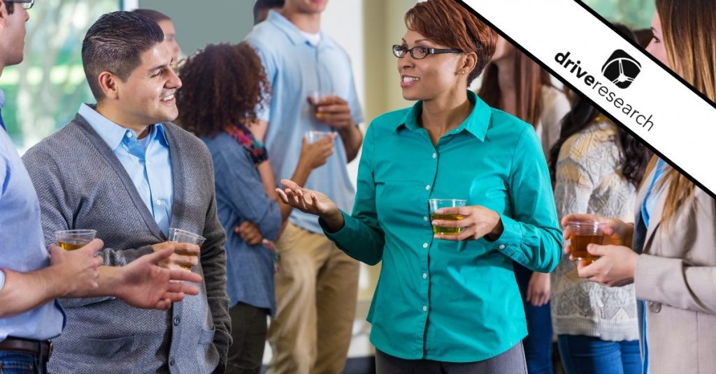 Professionals and alumni talking during mixer or party - Drive Research