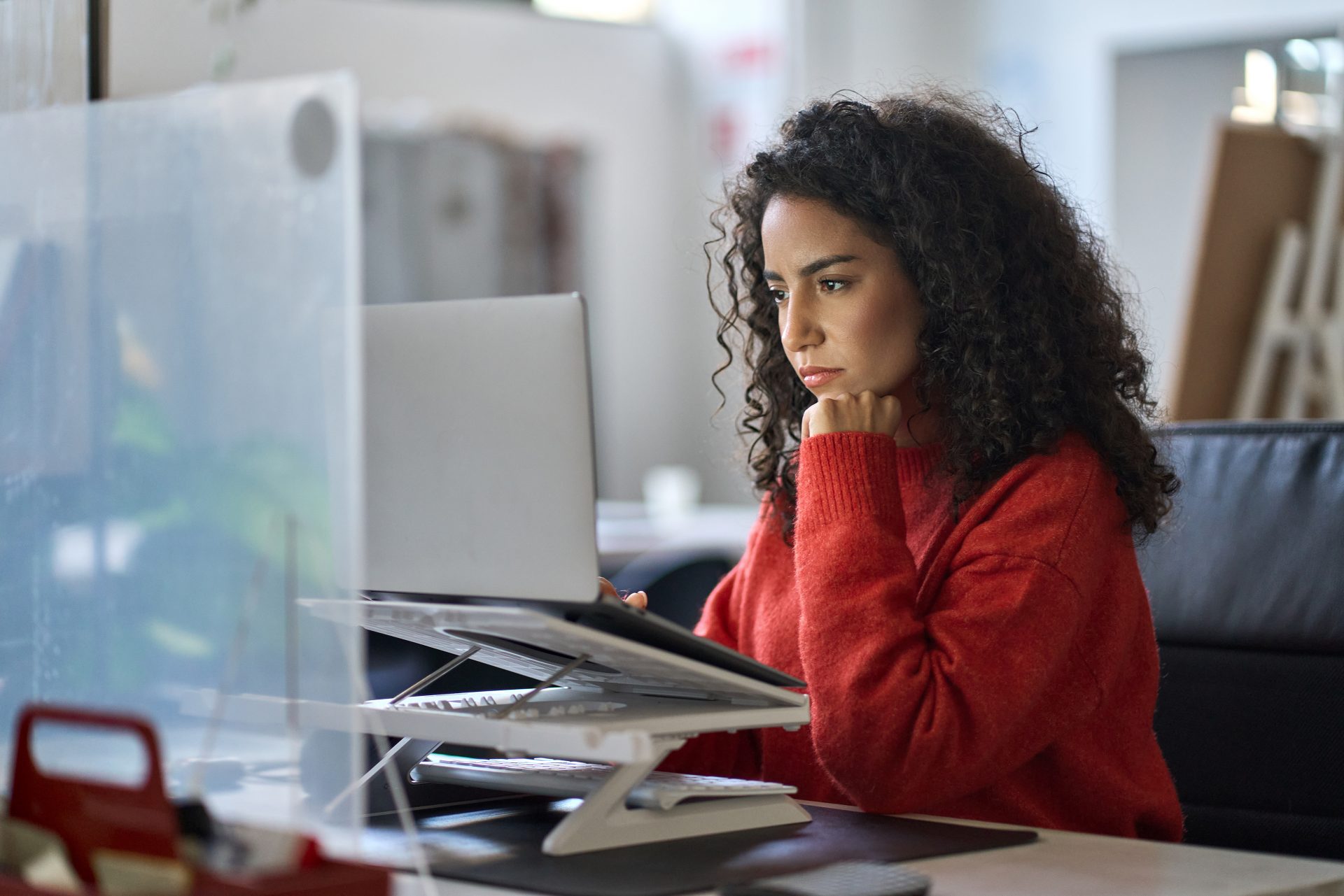 busy-latin-female-worker-working-on-laptop-thinkin-2025-02-11-16-16-04-utc