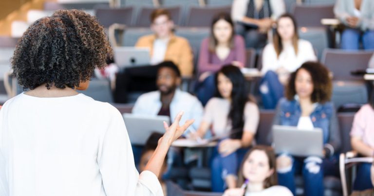 Higher education professional teaching a lecture to students