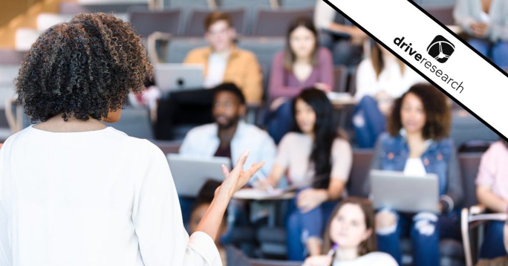 Higher education professional teaching a lecture to students - drive research