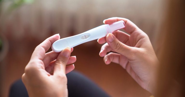 IHUT participant reading pregnancy test results