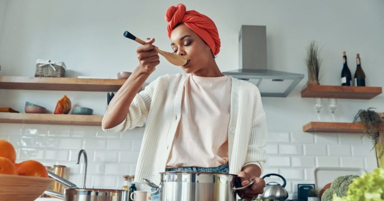 Woman doing a product taste test in her kitchen