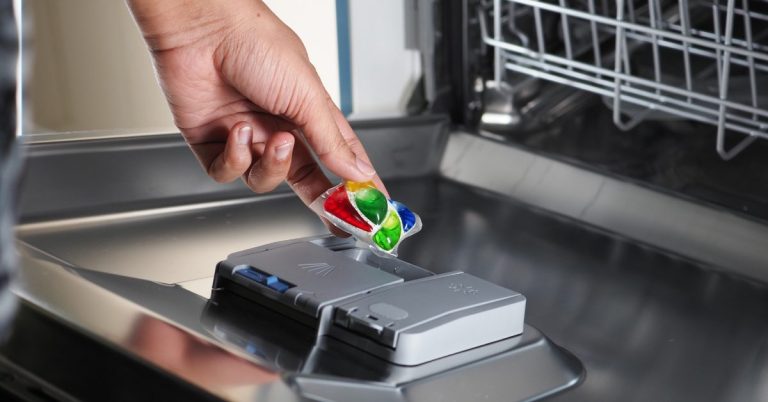 product test participant filling dishwasher with detergent pod